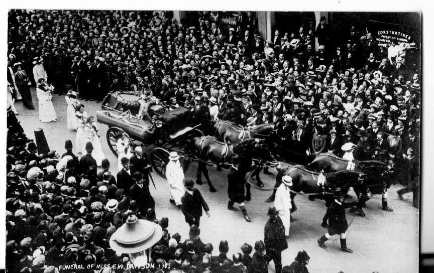 Emily Wilding Davidson’s funeral procession in Hart Street, as it approached St George’s Church in Bloomsbury, London © Elizabeth Crawford