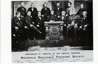 Photograph of thirteen of the original  members of the Rochdale Equitable Pioneers Society, postcard (image/jpeg)
