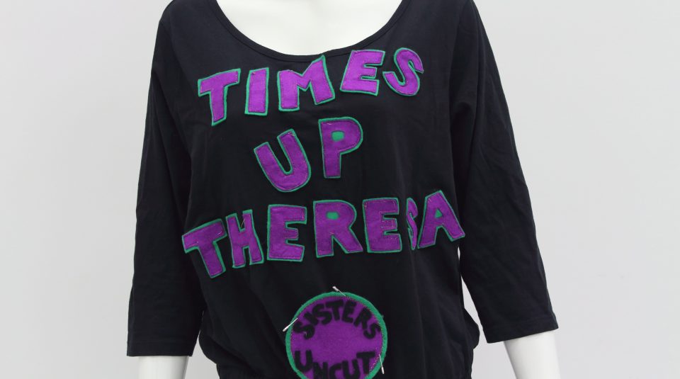 2 June 2018 - 3 February 2019, Represent! Voices 100 Years On exhibition @ People's History Museum. Time's Up Theresa jumpsuit, 2018 © Sisters Uncut