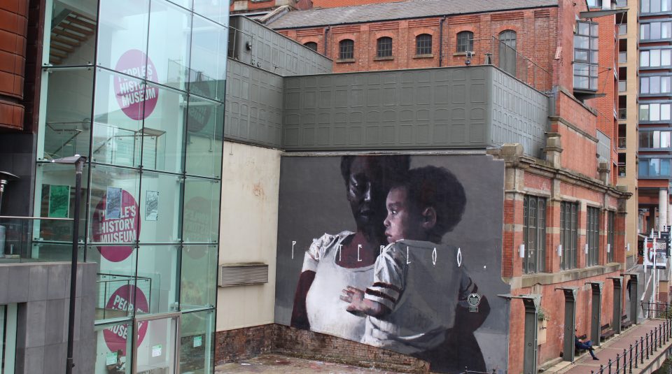 Image of Peterloo. mural (2018) by street artist Axel Void, on People's History Museum building exterior.