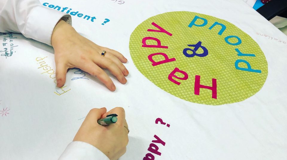 Happy and Proud project banner, 2019. Created by project participants and local women © Participation Works NW