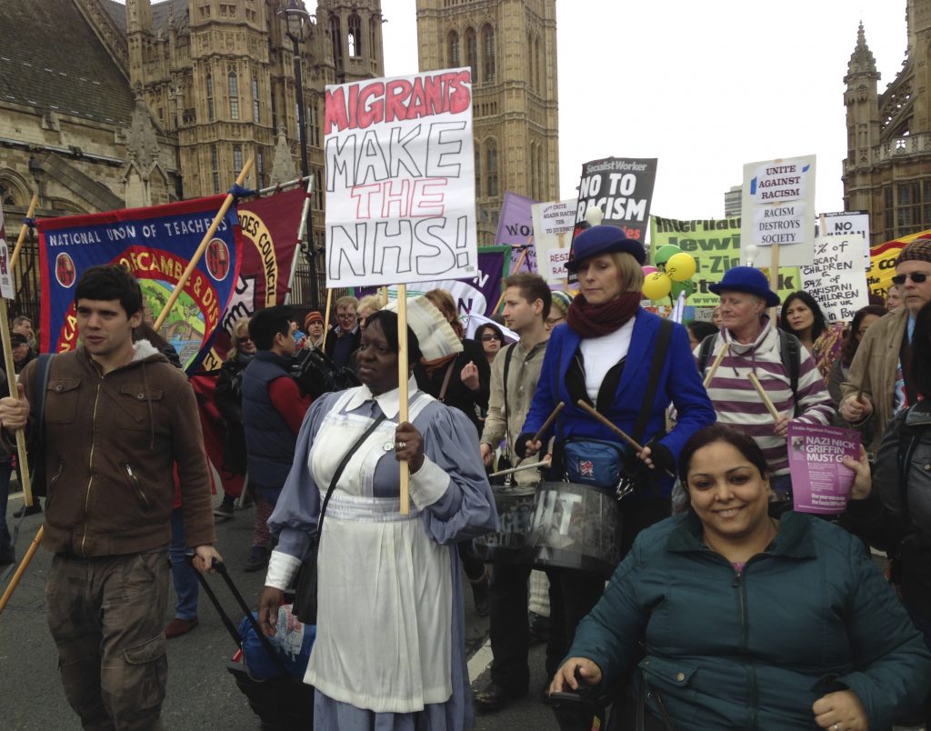 Migrants make the NHS, showing RAPAR activist Manjit Kaur, Anti Racist Day march © Mark Krantz