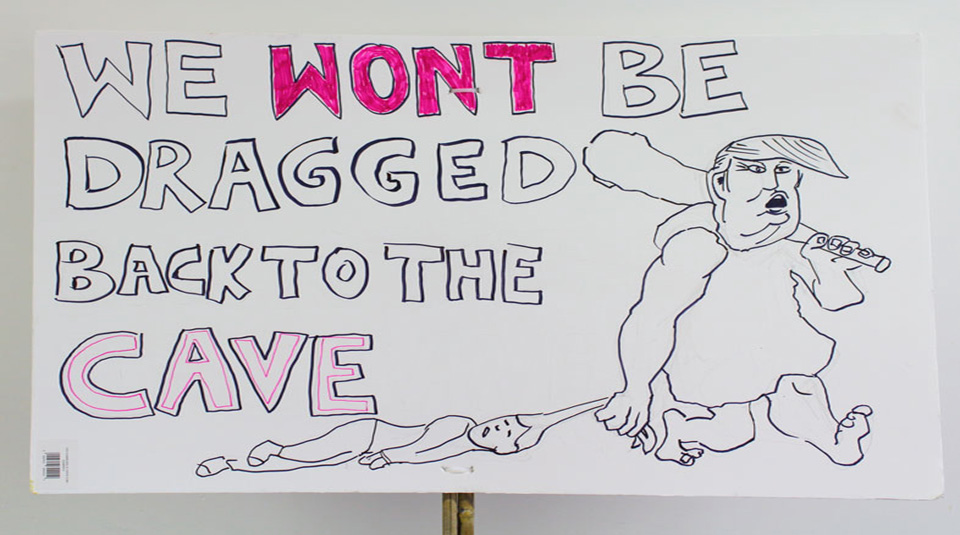 Image of 'We Won't Be Dragged Back To The Cave', placard from the Manchester Women's March, 2017 © People's History Museum