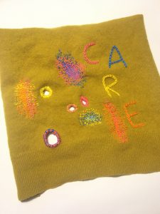 Textile piece with visible signs of mending