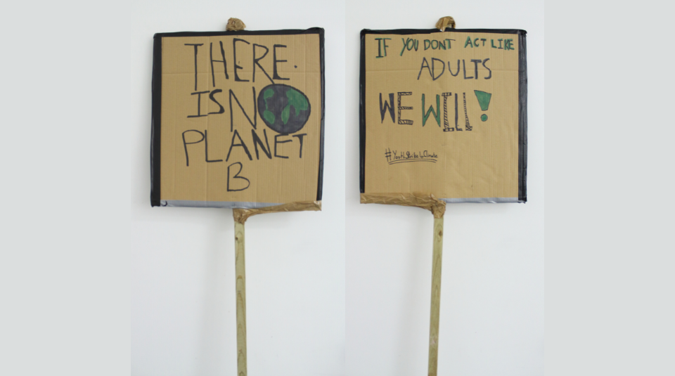 Image of Front & reverse of a cardboard placard. The text on the front reads There Is No Planet B and the reverse If You Don't Act Like Adults We Will