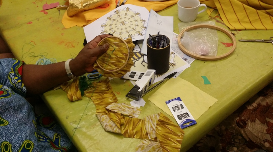 Image of Participant sewing with embroidery hoop at The Fabric of Protest workshop at Peoples History Museum.