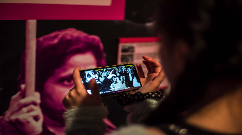 Image of visitor trying out the Grunwick strike (1976-1978) interactive digital experience in the Citizens section in Gallery Two at People's History Museum.