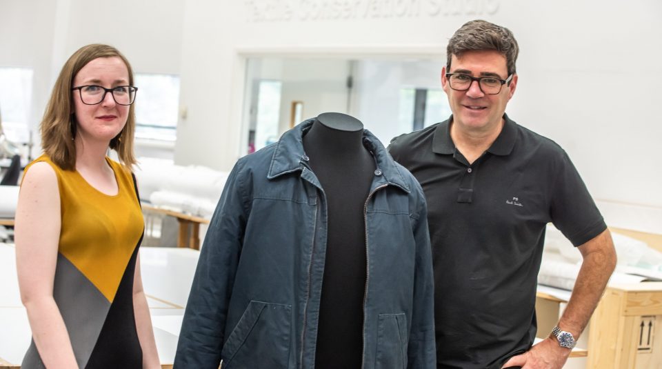 PHM Textile Conservator Beth Gillions with Andy Burnham and Andy Burnham's dark navy workers' jacket, 2020