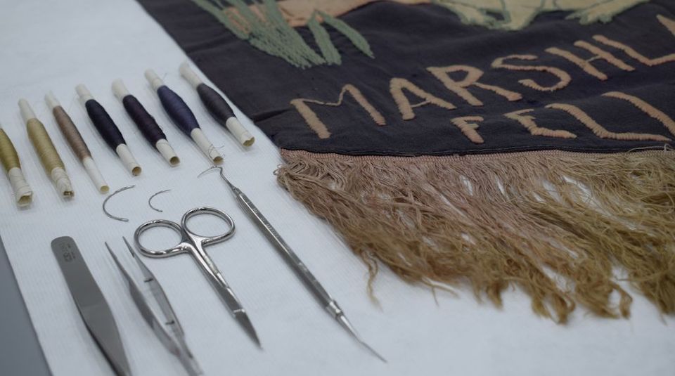 Image of Tools and threads for modern conservation dyeing in the Conservation Studio at People's History Museum