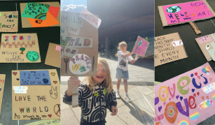 Image of colourful placards and children waving their creations.