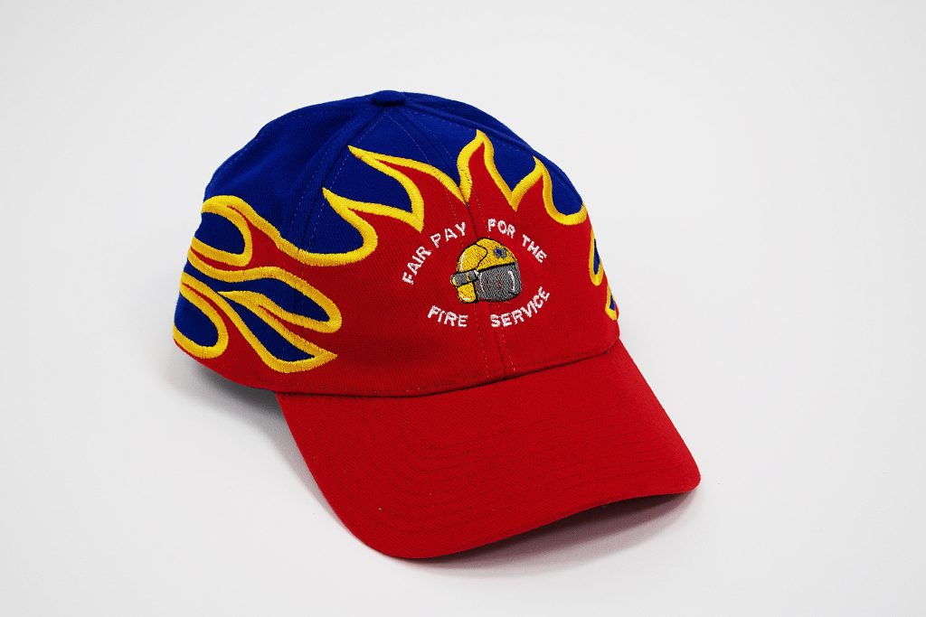 Fire Brigades Union Fair Pay For The Fire Service cap, 2002-2003. Image courtesy of People's History Museum.