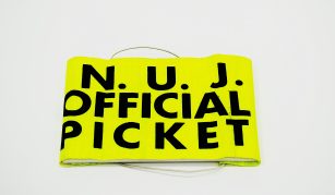 Image of National Union of Journalists Official Picket armband, around 1985. Image courtesy of People's History Museum.
