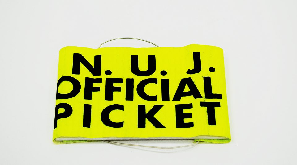 Image of National Union of Journalists Official Picket armband, around 1985. Image courtesy of People's History Museum.