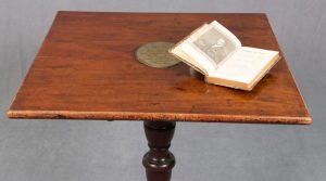 Thomas Paine’s wooden desk, with a copy of his 1791 book 'Rights of Man' lying open on the top.