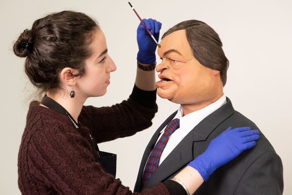 PHM Conservator Kloe Rumsey with Spitting Image puppet of John Prescott, around 1992. Image courtesy of People's History Museum