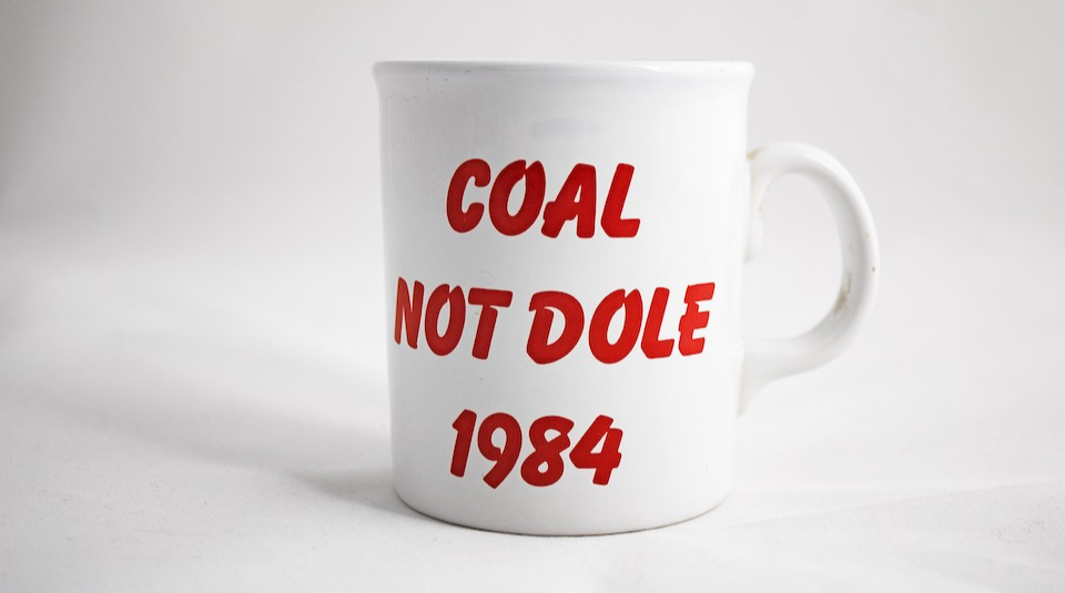 Image of A white mug with red text which reads Coal Not Dole 1984