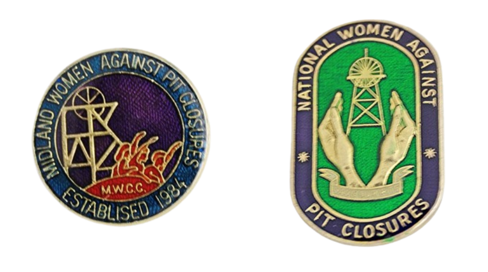 Left to right Blue, red, and purple round badge with an illustration of people with raised fists and a pit wheel. Text reads: ‘Midland Women Against Pit Closures. Established 1984’.and Purple and green badge with gold illustration of hands surrounding a pit wheel. Text reads: ‘National Women Against Pit Closures’.