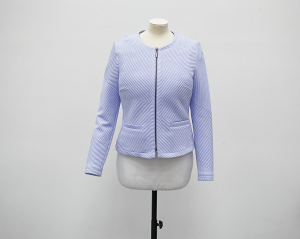 A pale blue round neck zip up jacket with two front pockets on a mannequin.