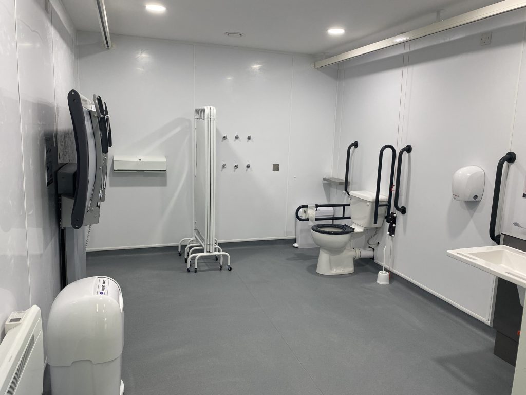 white room with Changing Places toilet and facilities.