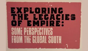 Image of Red exhibition board, the text in black and white reads Exploring the Legacies of Empire: Some Perspectives from the Global South