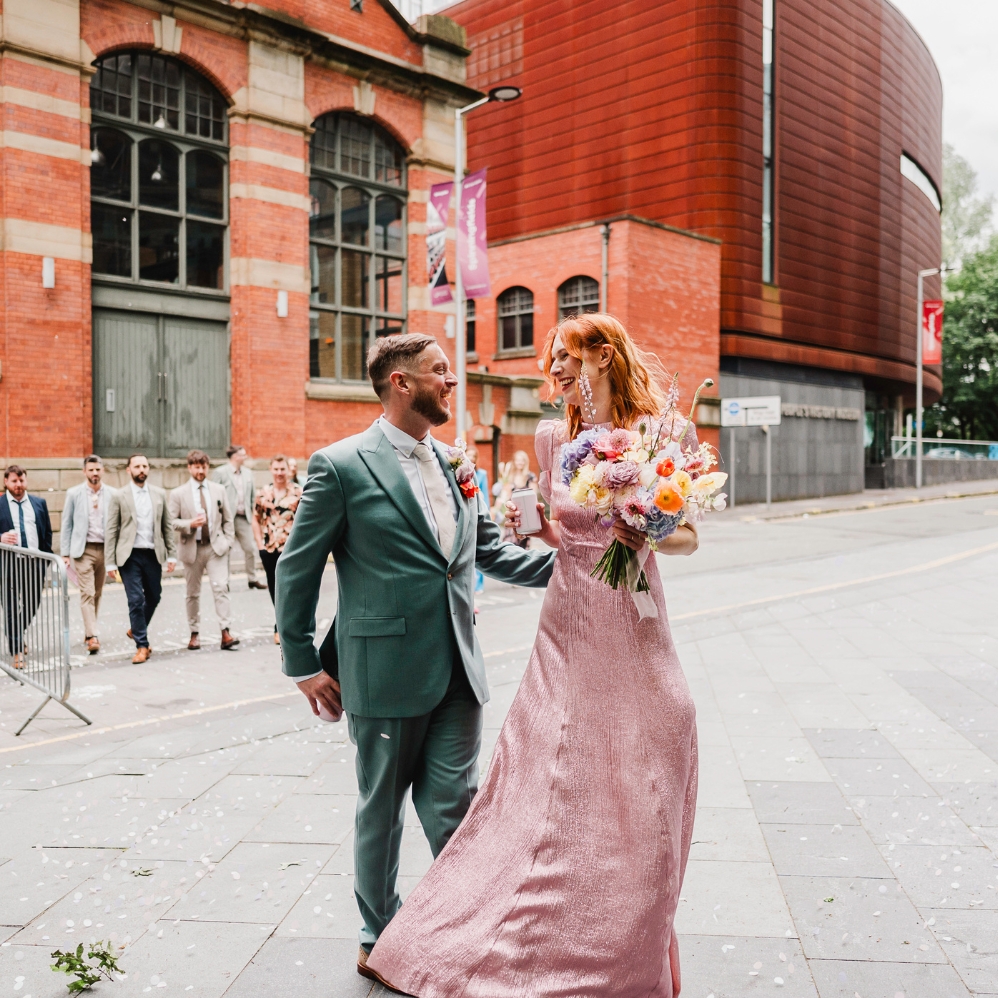 Image of Two people outside a building