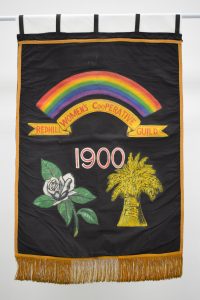 A black banner with a rainbow