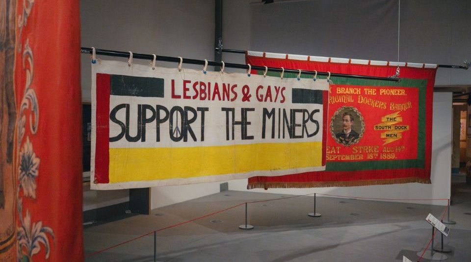 Image of Three large banners hanging in a gallery