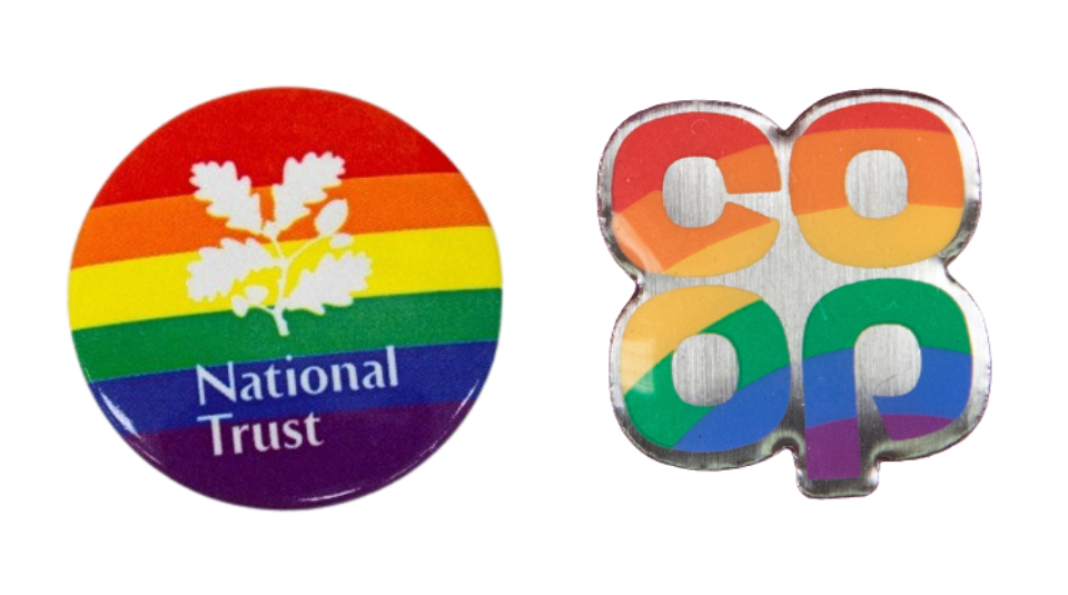 Rainbow badge with the National Trust oak leaf logo and name in white and rainbow enamel pin reading ‘co op’ in the stylised brand font of the Co-op supermarket shop.