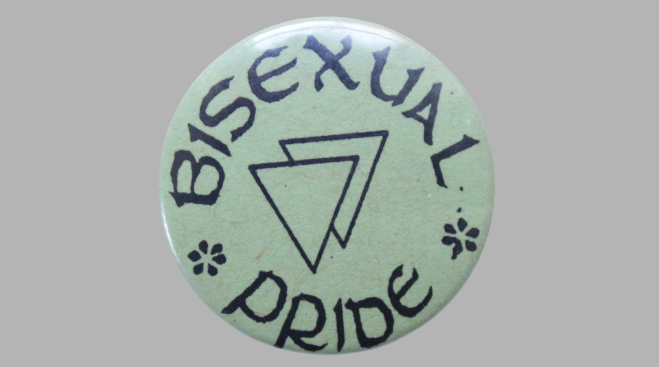 Image of Green circular badge with black text reading 