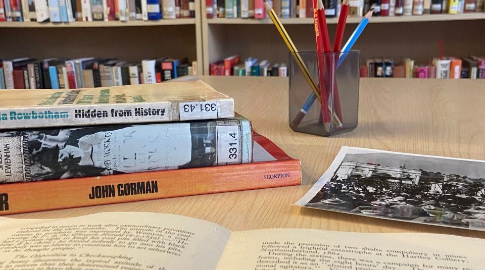 Image of Pile of books and archive material on a desk