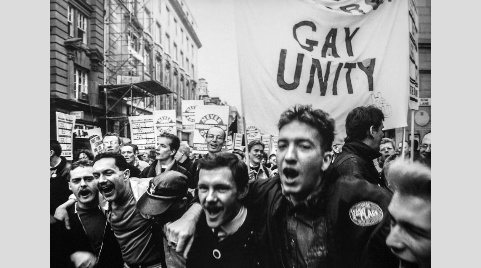 Image of Black & White photograph of crowd of protestors holding banners and placards