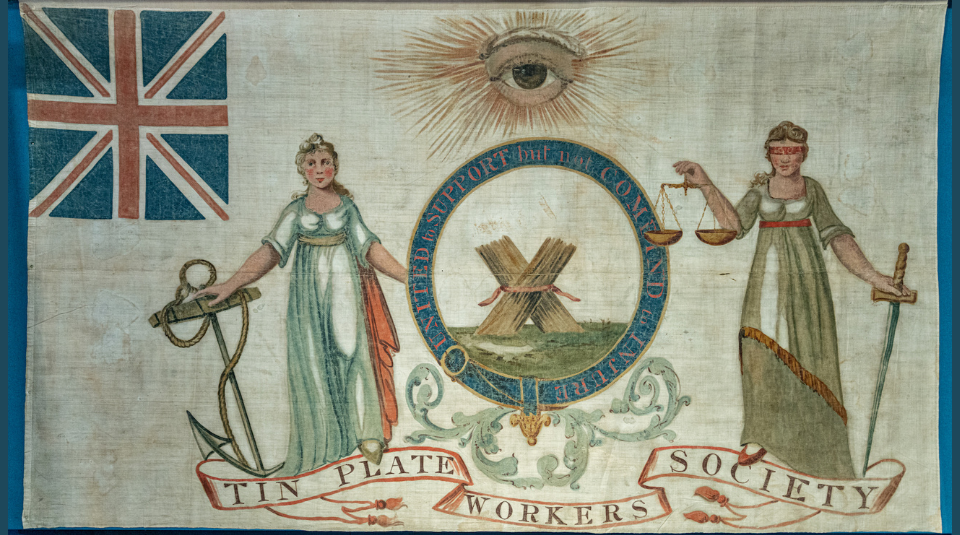 Image of Central painted image is a bundle of sticks, surrounded by ‘UNITED TO SUPPORT BUT NOT COMBIND TO INJURE’. Above this an eye, and either side two female figures. One holds an anchor, the other is blindfolded holding scales and a sword. Top left is a union flag.