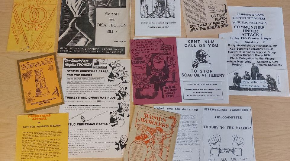 Image of A collection of flyers, leaflets and posters on a table.