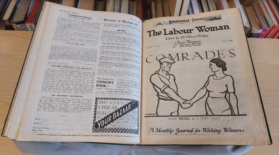 Image of An open book of bound magazines, including typed articles and a line drawing illustration. The text includes The Labour Woman.
