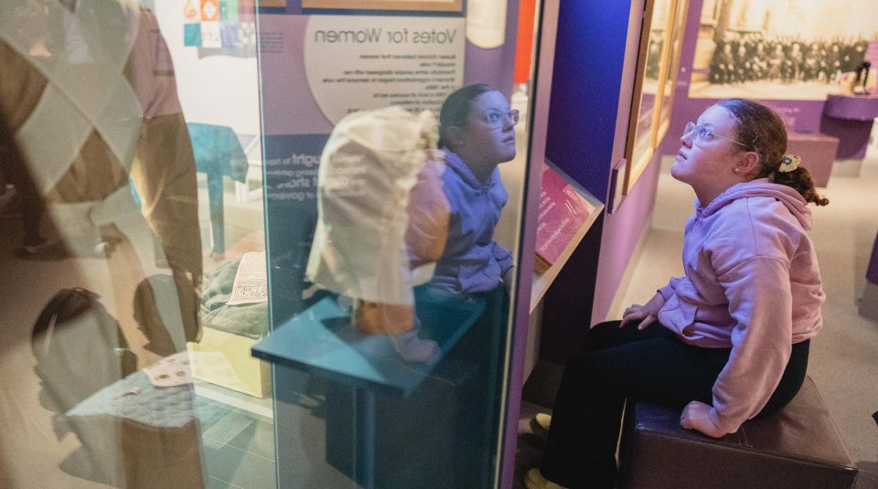 Image of A person sat looking at a museum display