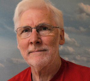 Colour photograph of a white man.