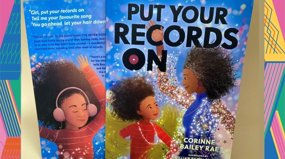 Image of A colourful book back and front cover with illustrations of a child and adult with long curly hair, including text: 'Put Your Records On'.