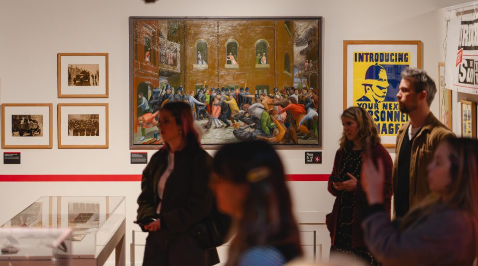 Image of Colour photograph of a group of people on a tour in a gallery.