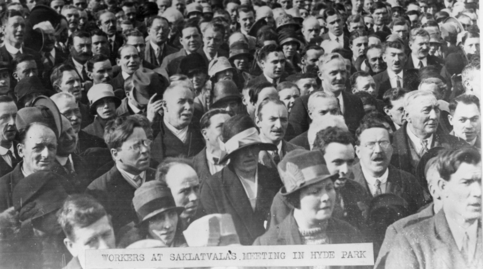 Image of Black and white photograph of a big crowd facing towards the same direction, with a label of text reading: 'Workers At Saklatvala's Meeting In Hyde Park'.