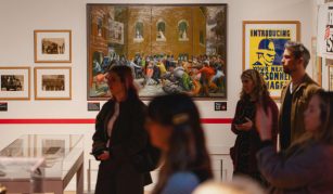 Image of Colour photograph of a group of people on a tour in a gallery.
