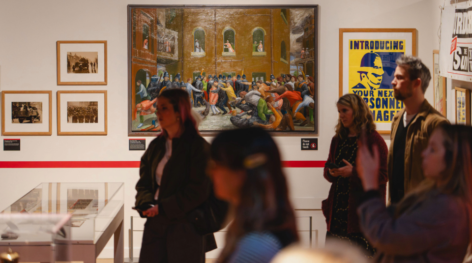 Image of Colour photograph of a group of people on a tour in a gallery.
