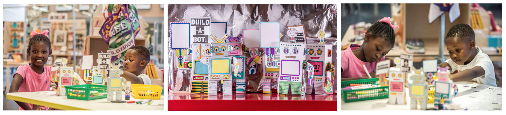Children sat a a table carrying out a craft activity to colour and cut out a paper robot model.