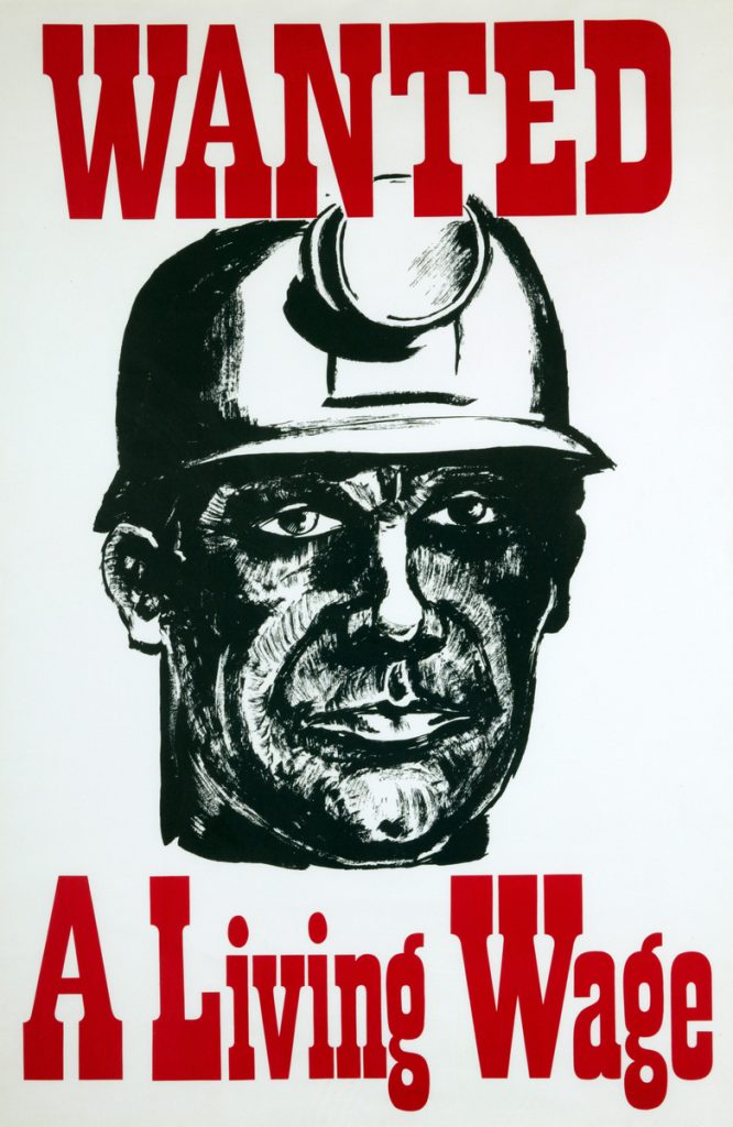 Wanted, A Living Wage poster, 1972. NMLH.2003.15.33. Artist unknown. Poster with a black and white illustration of a miner wearing a hard hat with headlamp, with large red text: 'Wanted, A Living Wage'.